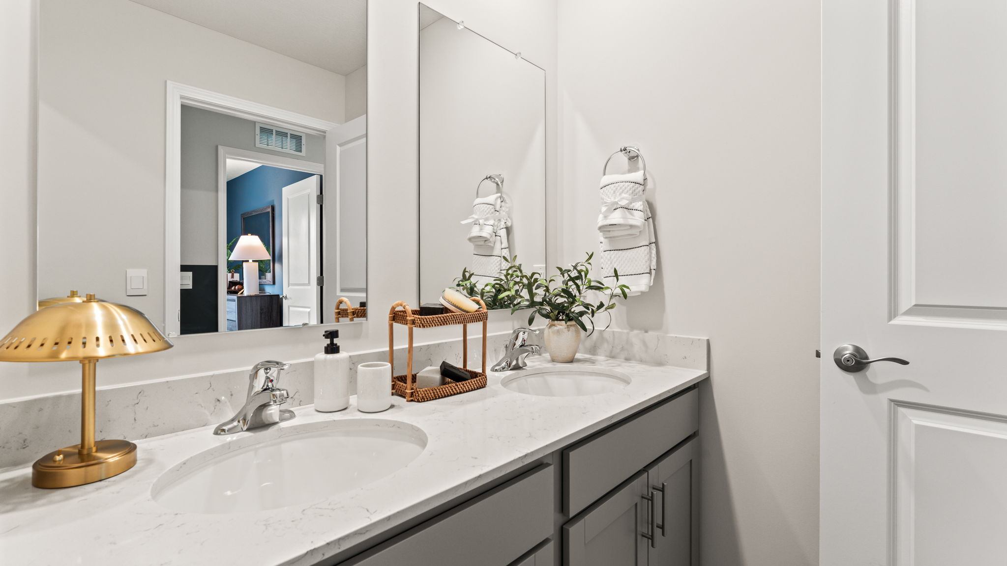 Closeup of bathroom with white countertops