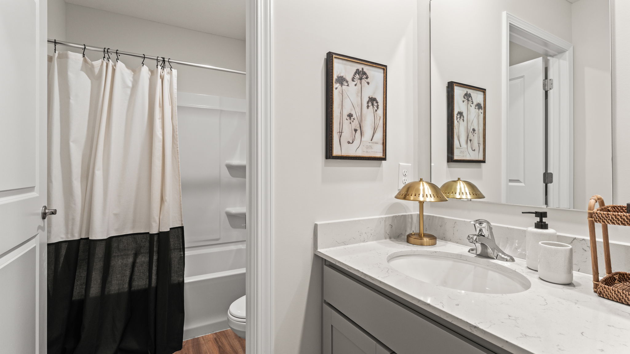 Bathroom with two-tone black and white shower curtain