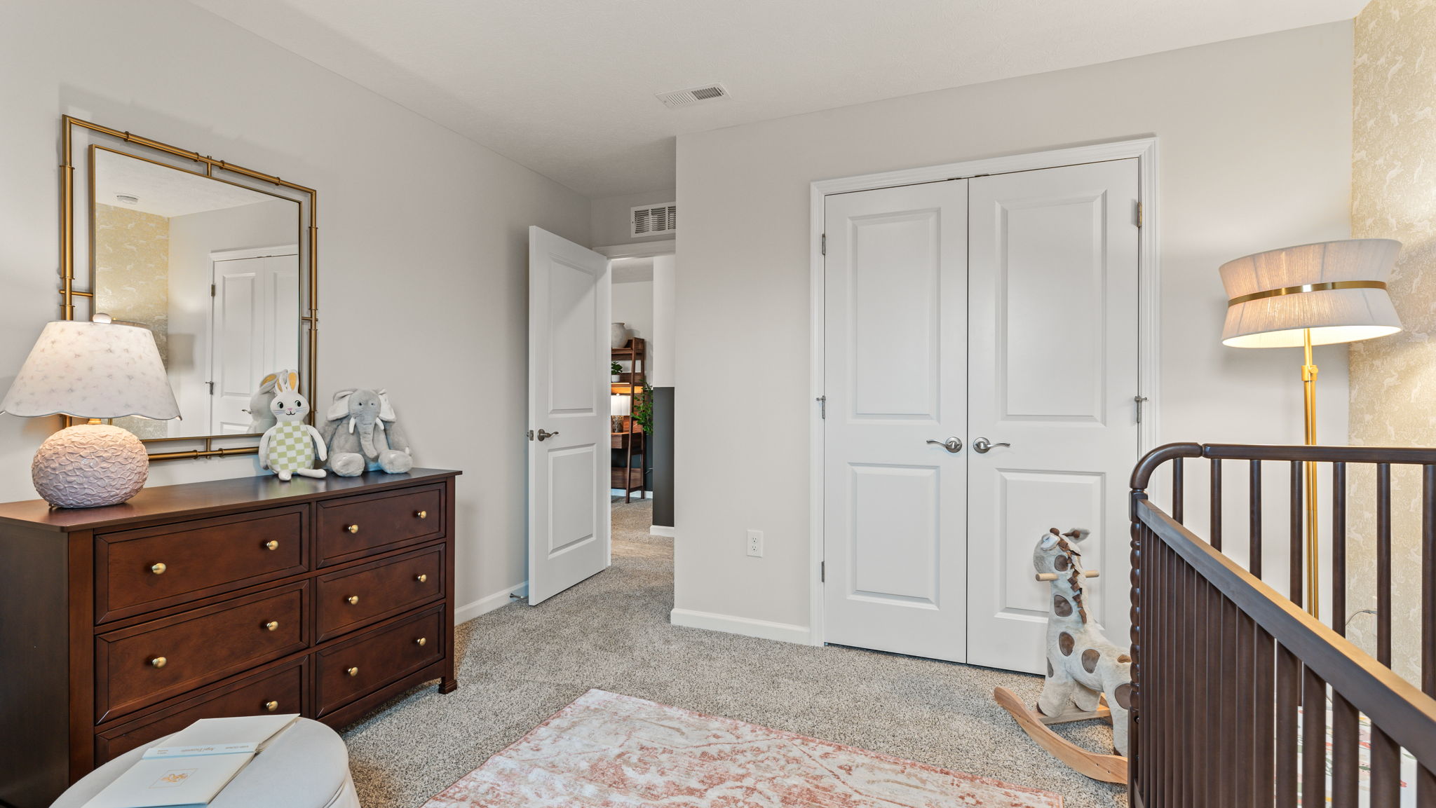 View from the window of a nursery room towards the closet and hallway