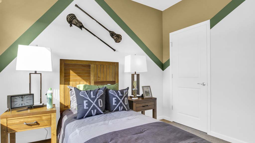 Left side close up on bed in lacrosse themed room.