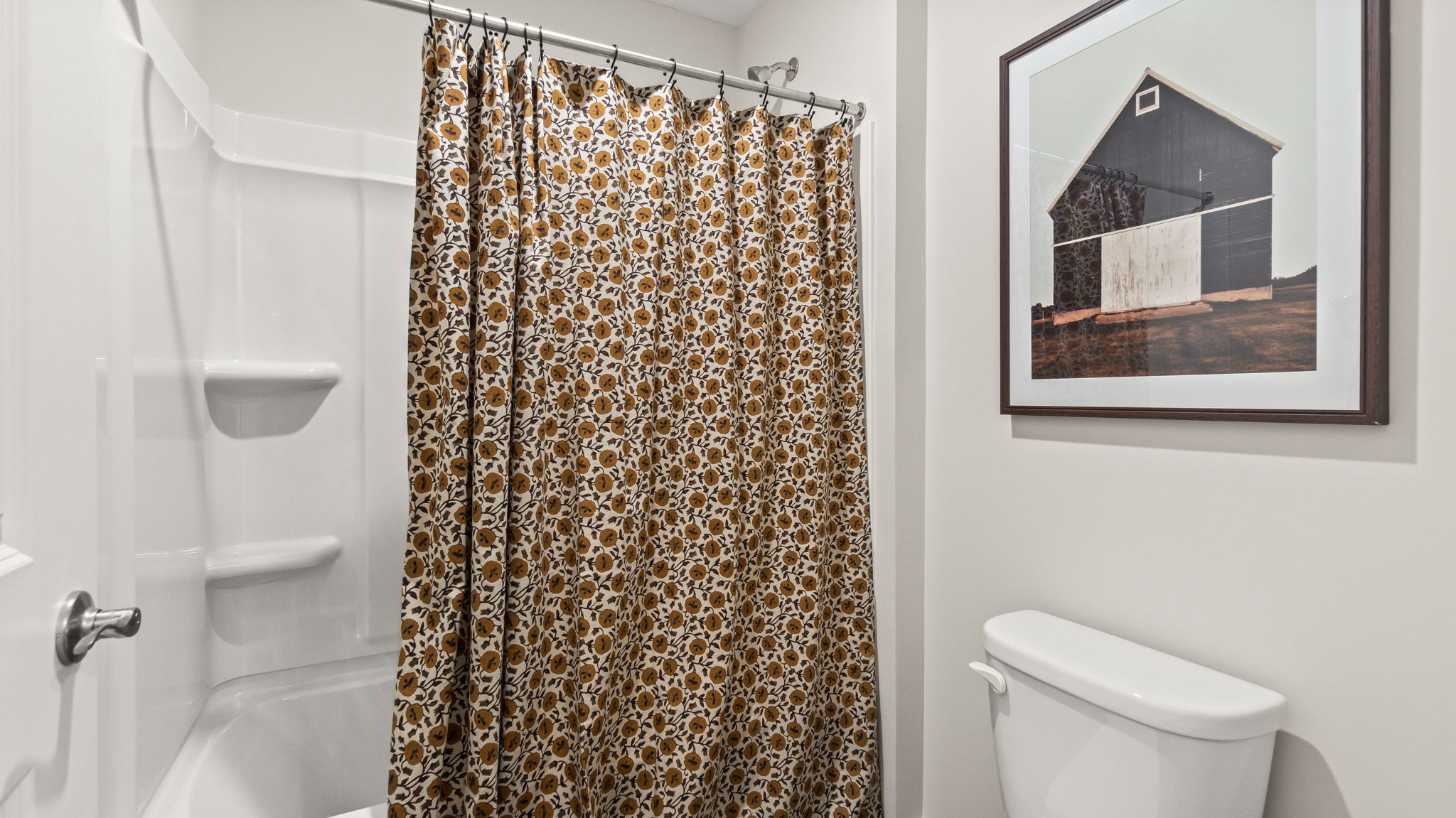 Closeup of shower with tiered shelving.