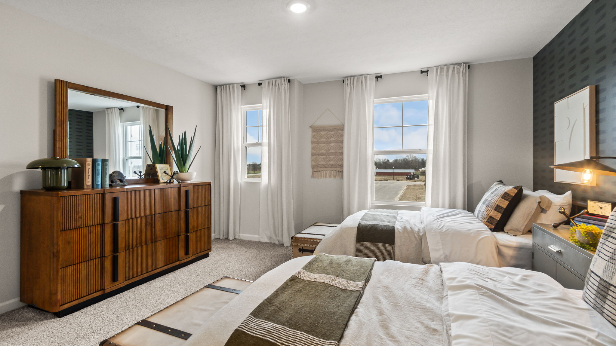 View of bedroom 2's windows and dresser.