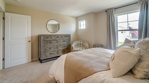 bedroom 2 with queen bed and dresser