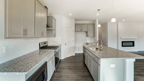 kitchen with island and grey cabinetry