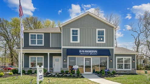 2 story Henley model home with grey siding, front porch and 3 car garage