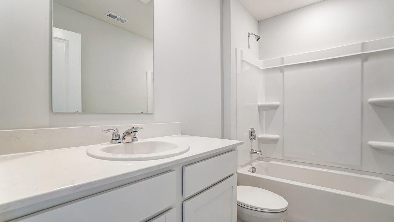 Interior bathroom with sink and full-sized shower