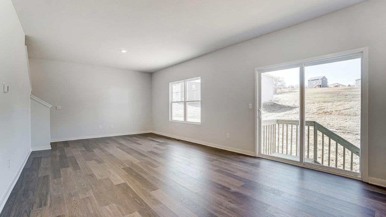 Interior living area with large window and back patio doors