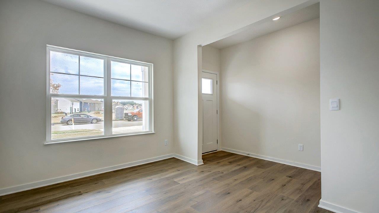 flex room with double window and foyer