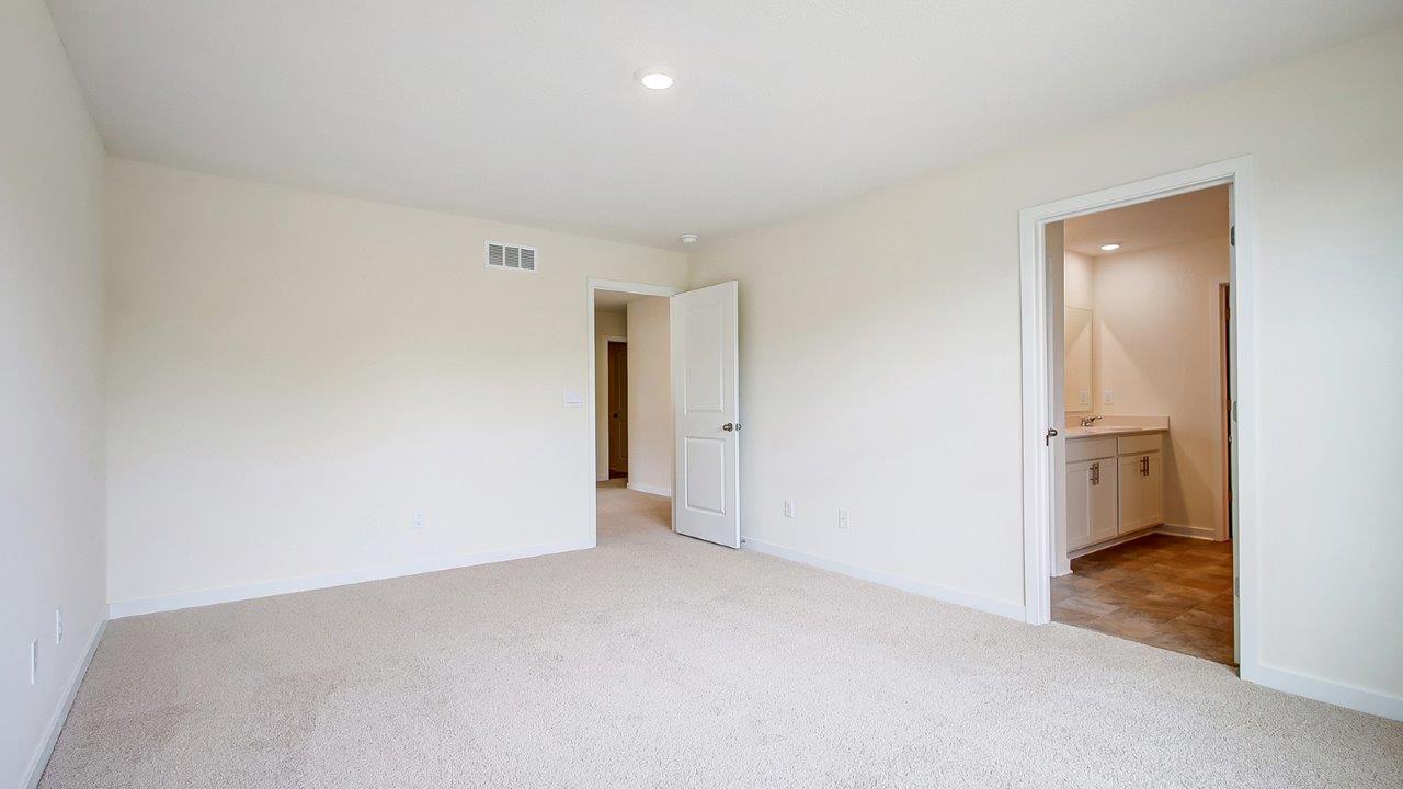 primary bedroom entry and ensuite bath