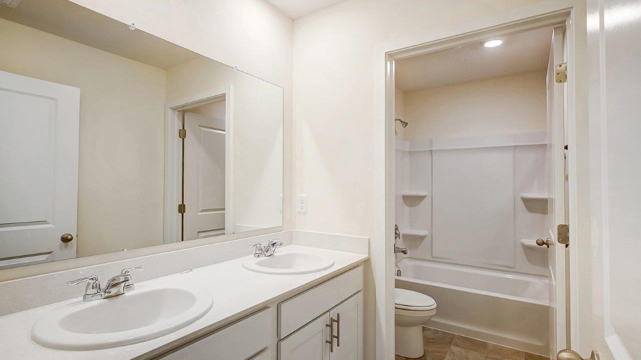 second full bath with double vanity and wet room