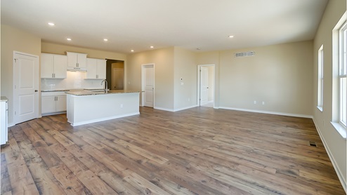 great room with hardwood floors and kitchen