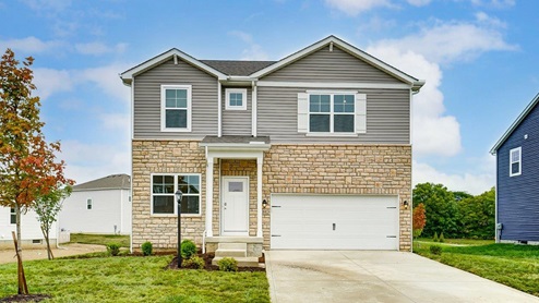 Two story home with grey siding, partial stone front, covered entry and two car garage