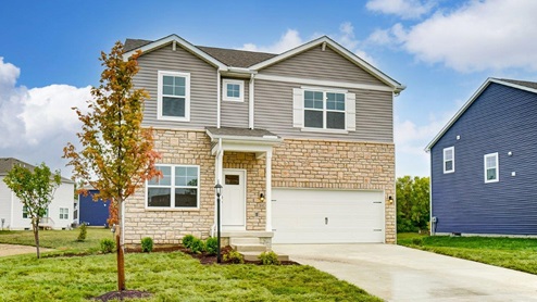 Two story home with grey siding, partial stone front, covered entry and two car garage