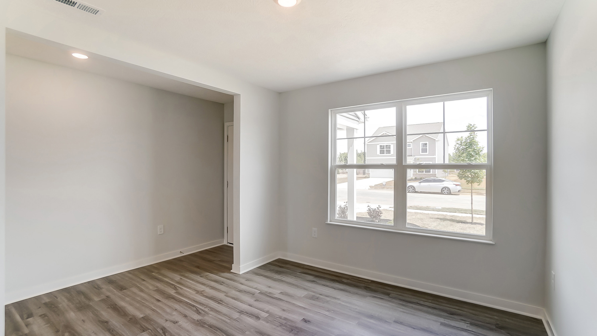 foyer and flex office space with double window