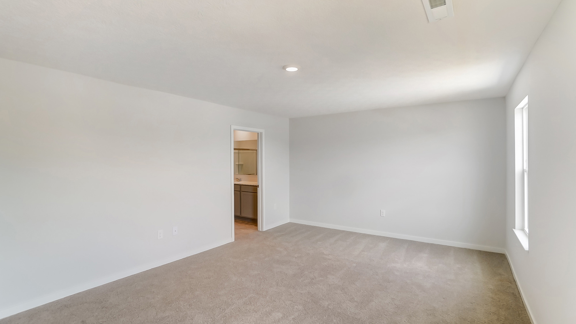 primary bedroom with ensuite bath