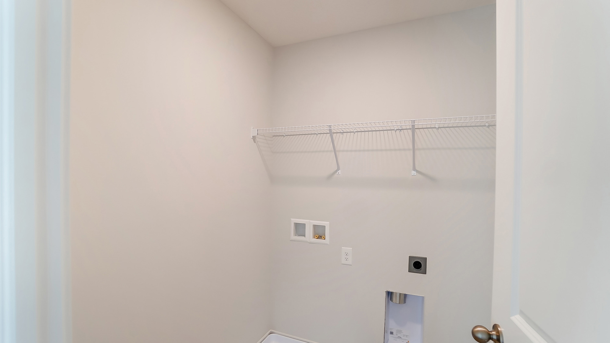 laundry room with wire shelving