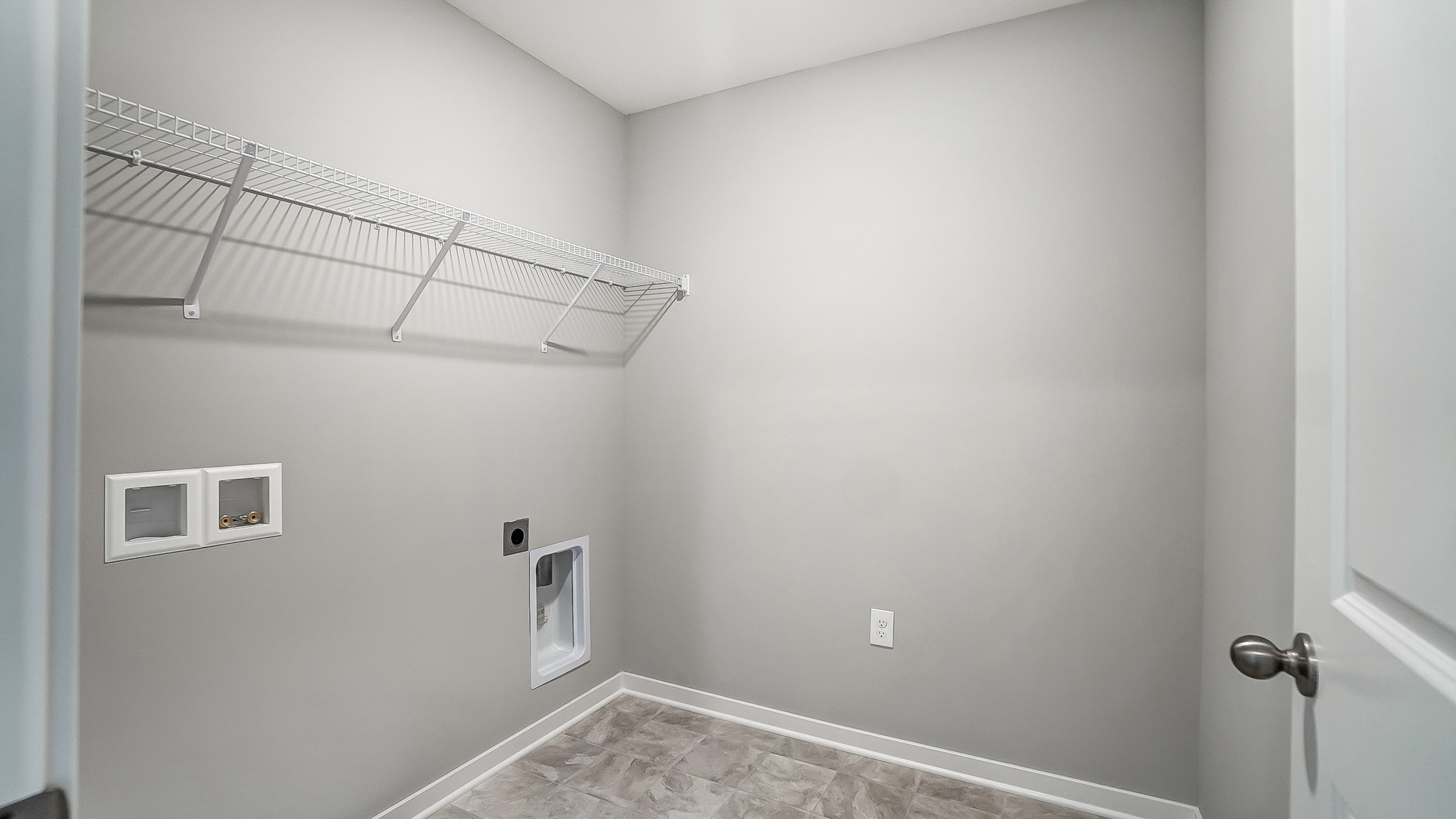 laundry room with wire shelving