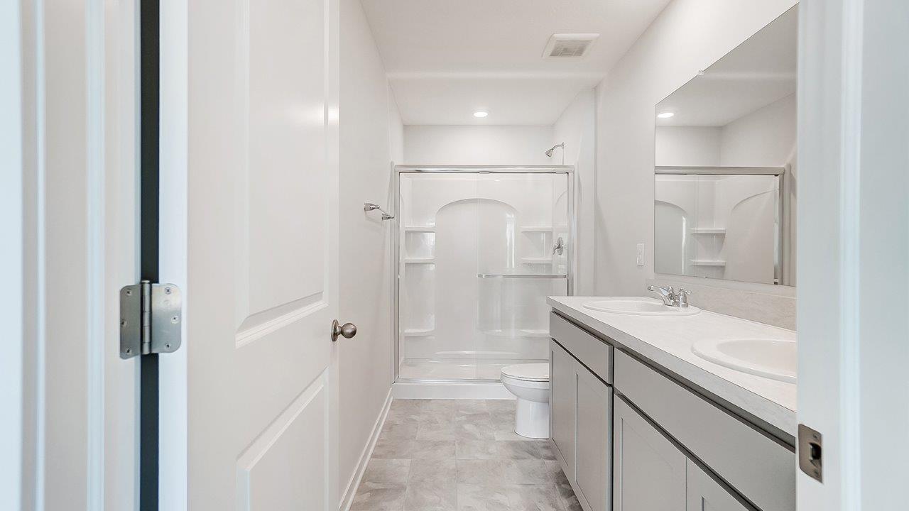 ensuite bath with double vanity and walk in shower