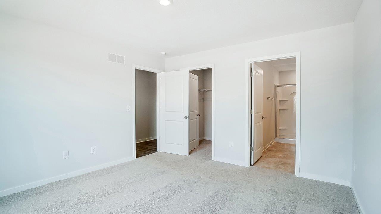 primary bedroom closet, doorway, ensuite bath