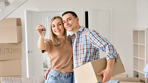 couple with boxes and keys lifestyle photo