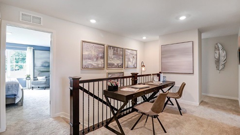 furnished flex loft space with desk and chairs