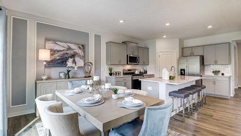 dining table with chairs and kitchen