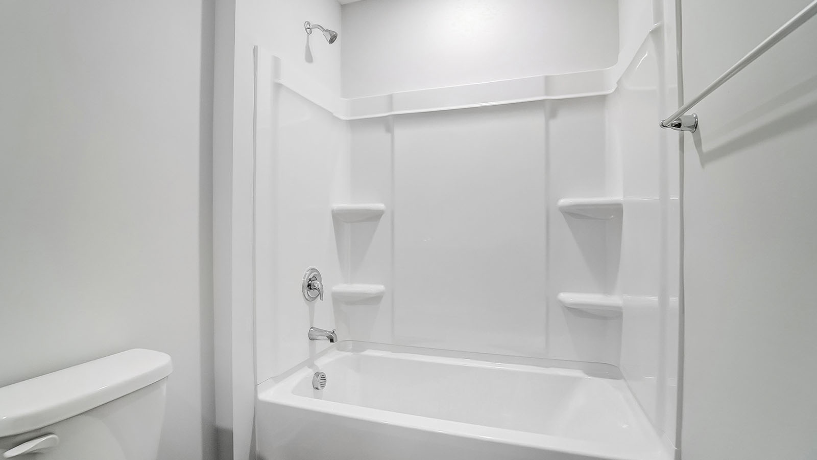 Bathroom featuring a sink, toilet, and shower tub.