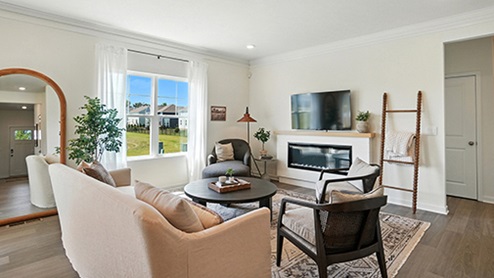 Bright Great Room with neutral contemporary furniture.