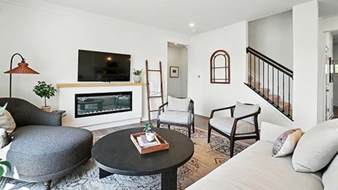 Bright Great Room with neutral contemporary furniture.