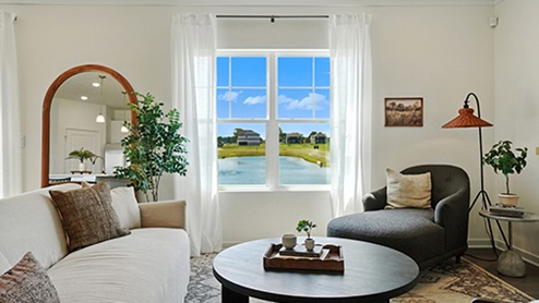 Bright Great Room with neutral, contemporary furniture