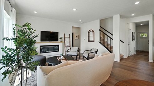 Bright Great Room with neutral, contemporary furniture