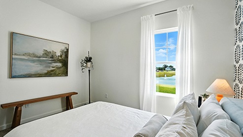 Guest bedroom with graphic wallpaper