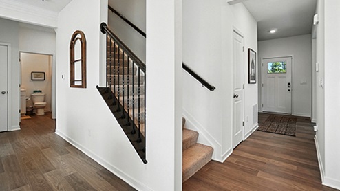 Stair view showcasing wood floors