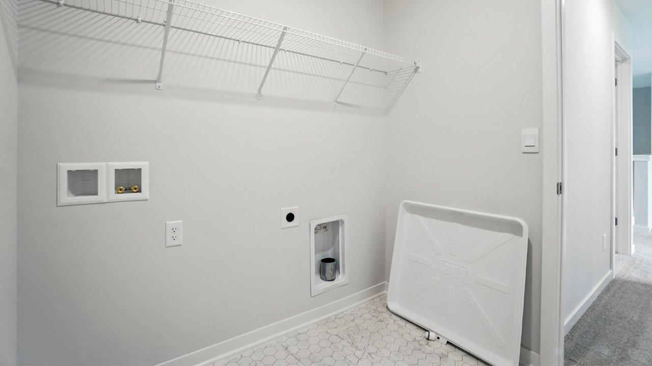 laundry room with wire shelving