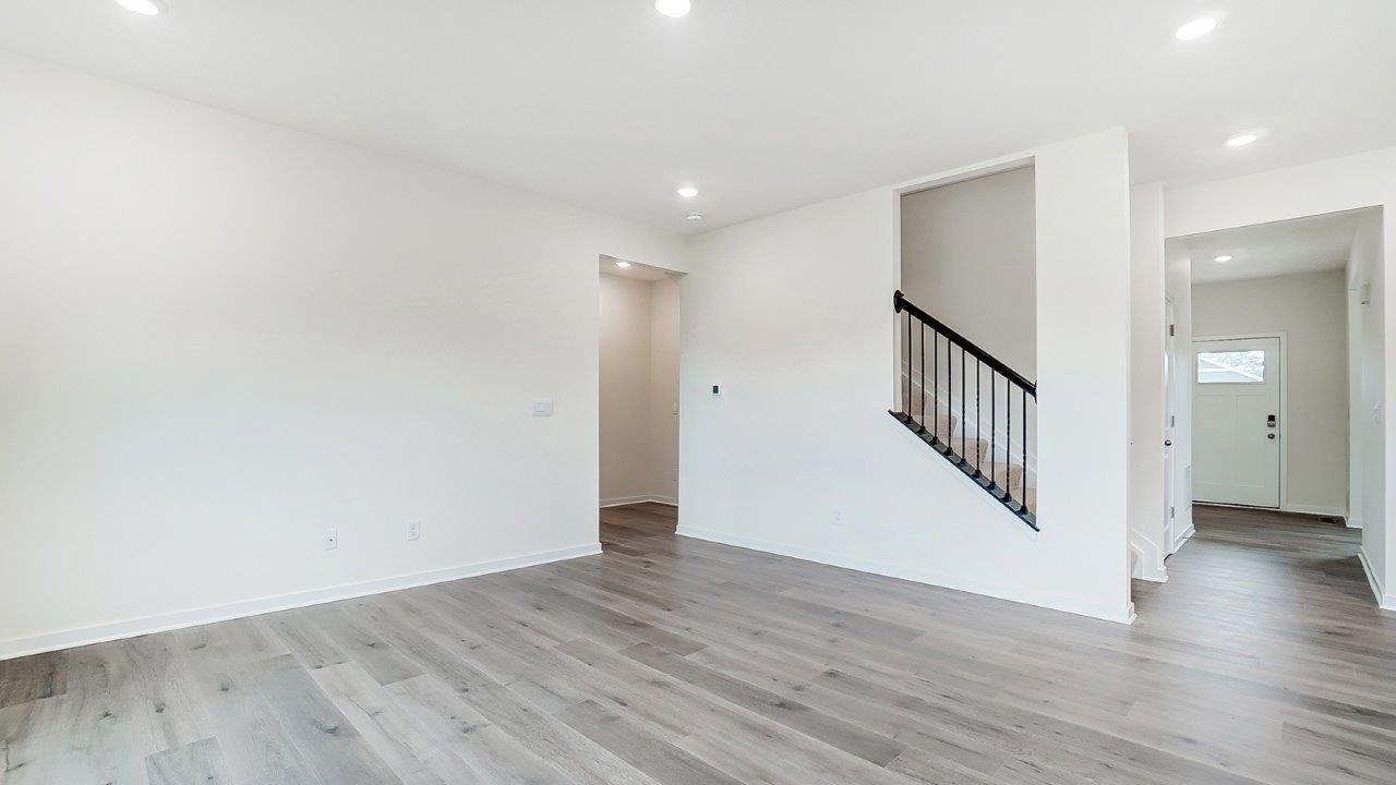 Open concept first floor with the living room, dining room and kitchen next to each other