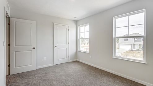secondary bedroom with two single windows