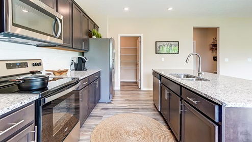 kitchen island, cabinetry and walk in pantry