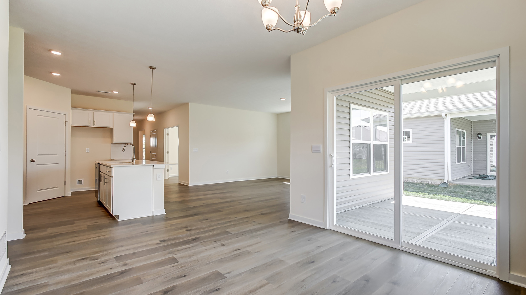 Dining area off the kitchen with a sliding door.