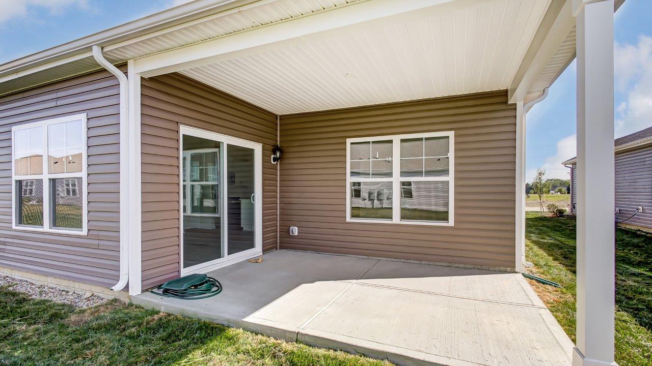 Covered patio and clean landscaping.