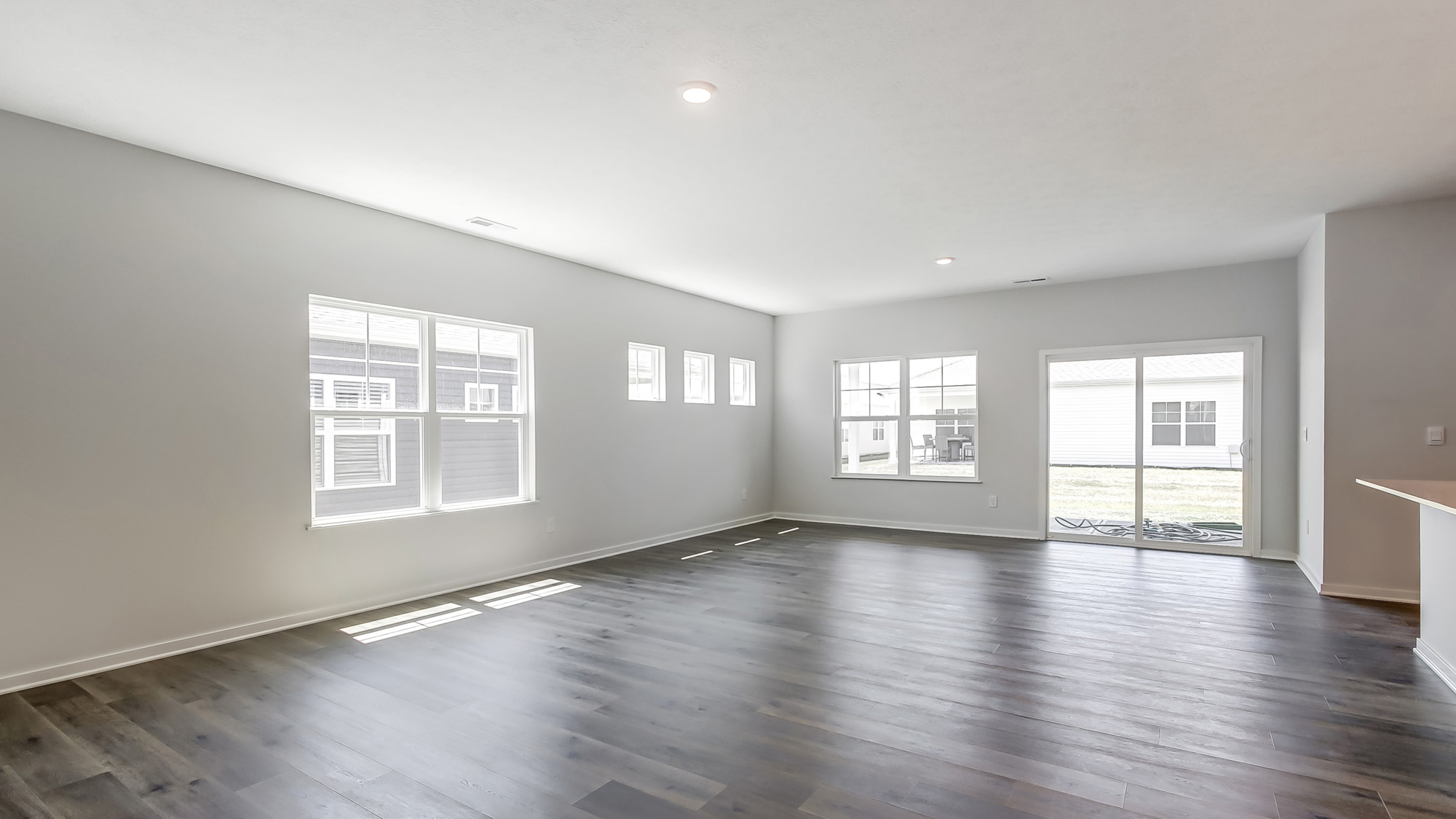 Open concept living space with natural light and a sliding door.