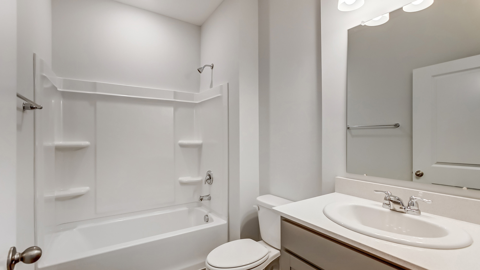 Bathroom featuring a sink, toilet, and shower tub.