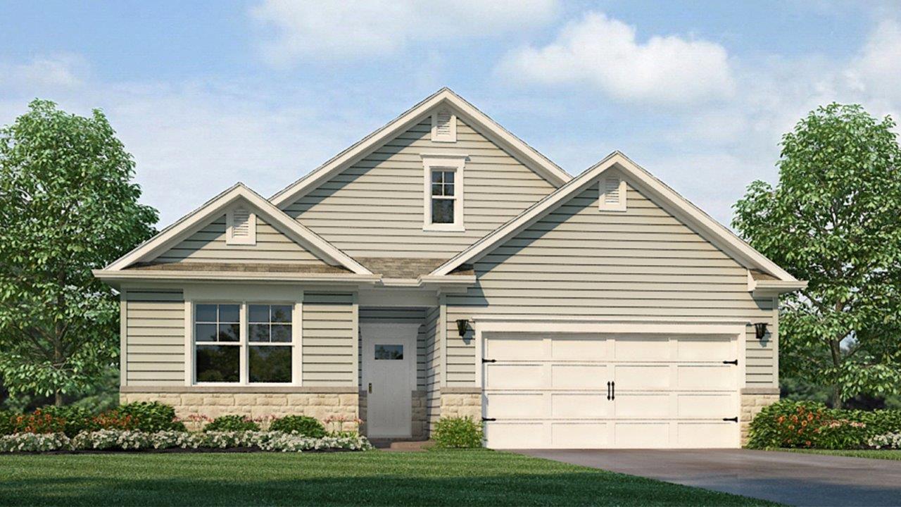 One story home with two car garage and paved driveway.