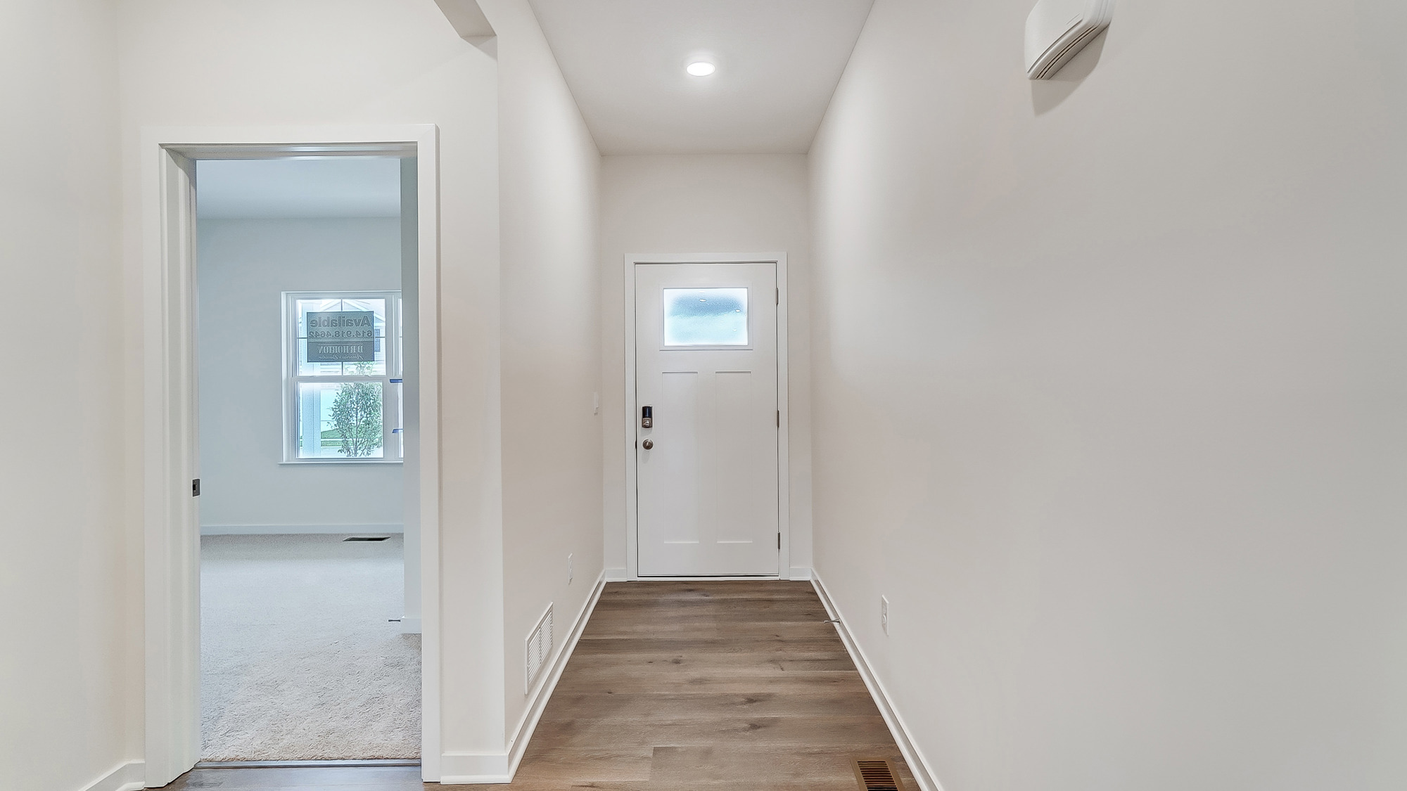 Entryway with bright hallway.