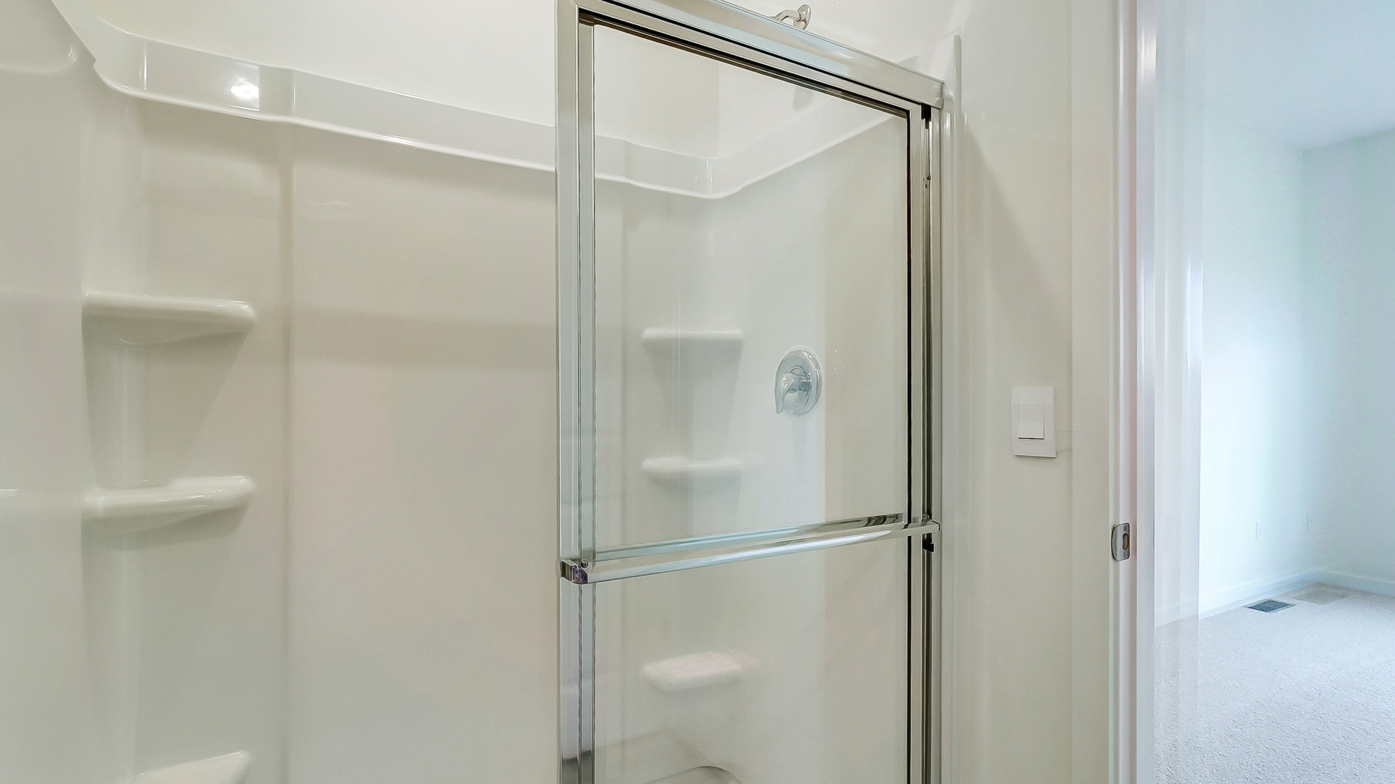 Modern bathroom featuring a walk in shower.
