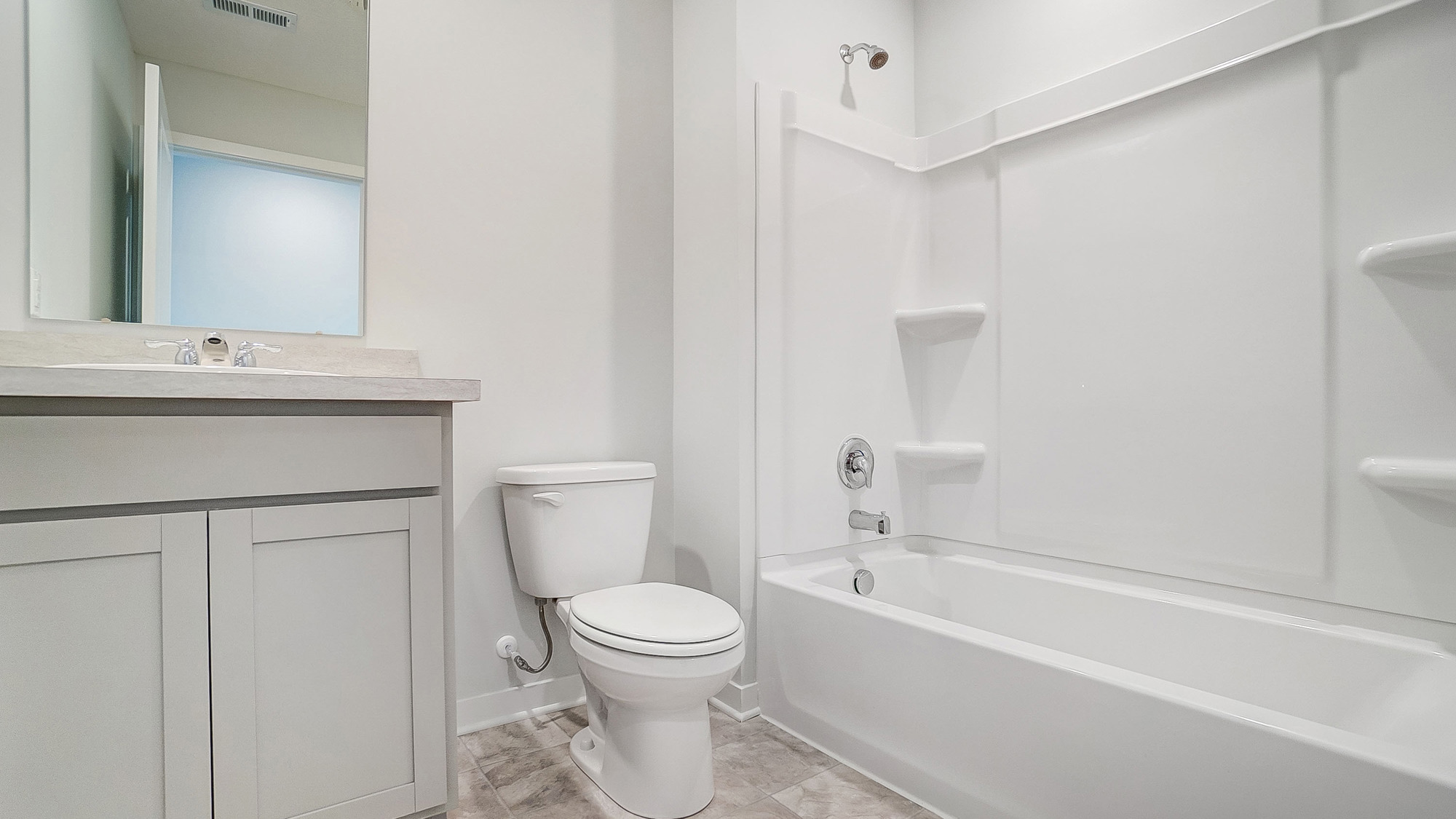 Bathroom featuring a sink, toilet, and shower tub.