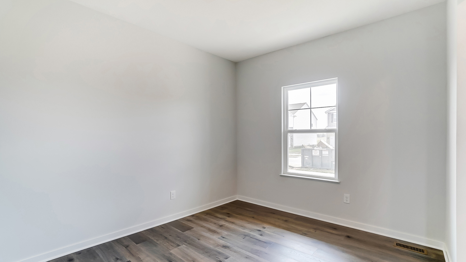 Bright dining area with neutral walls off the entry.
