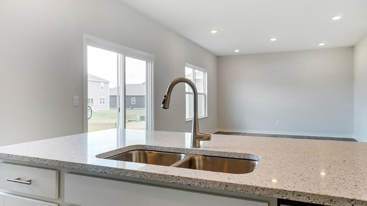 Kitchen island overlooking spacious living area.