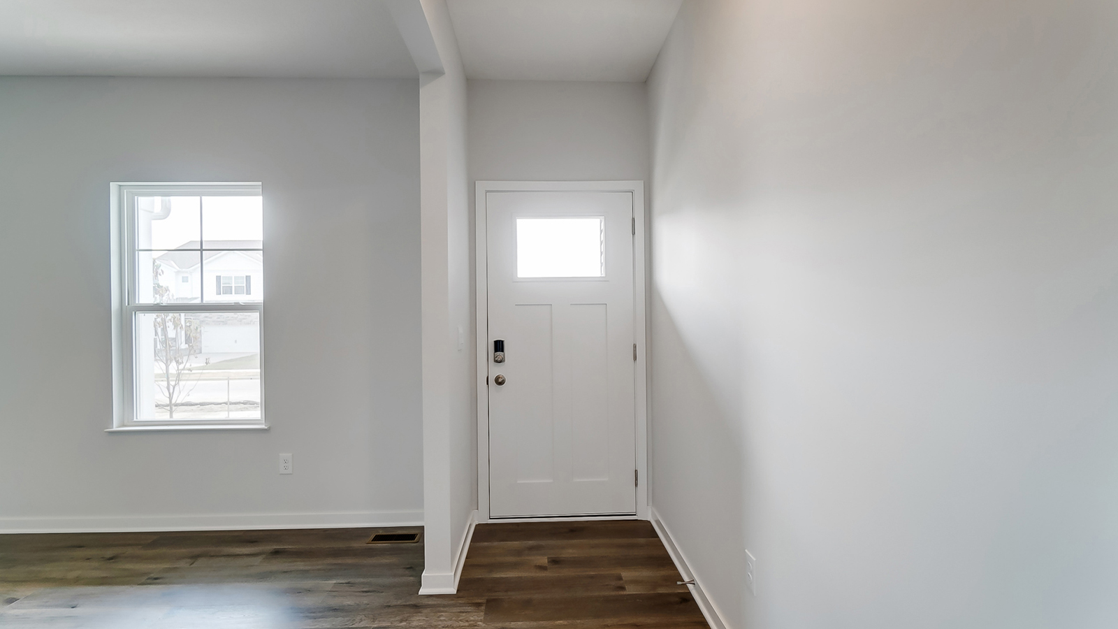 Entryway with bright hallway.