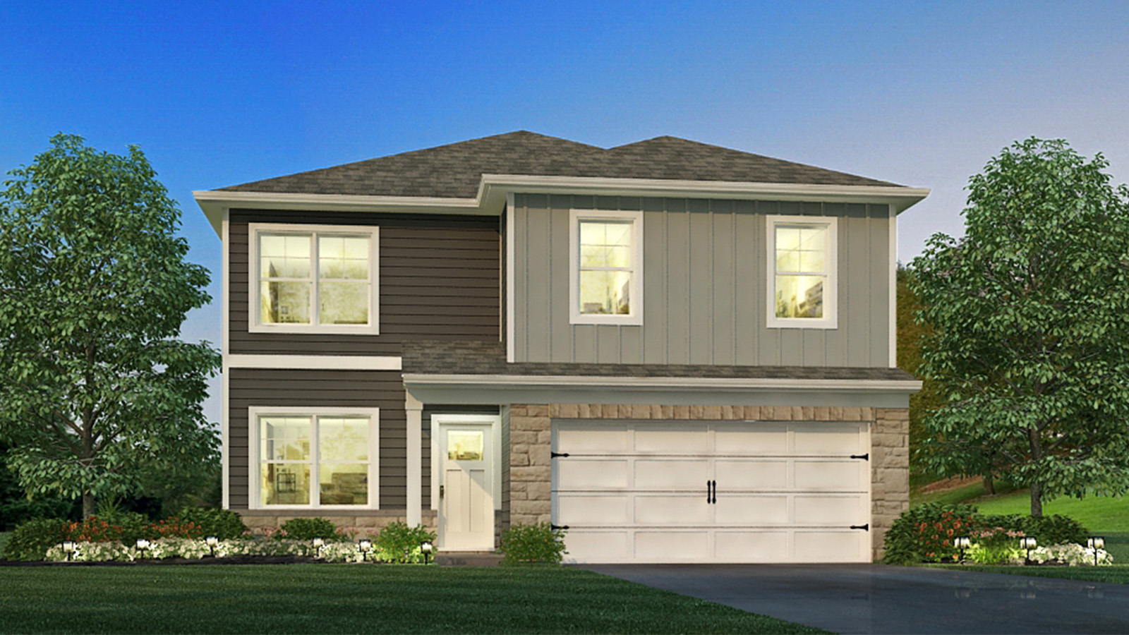 Two story home with attached garage and clean landscaping