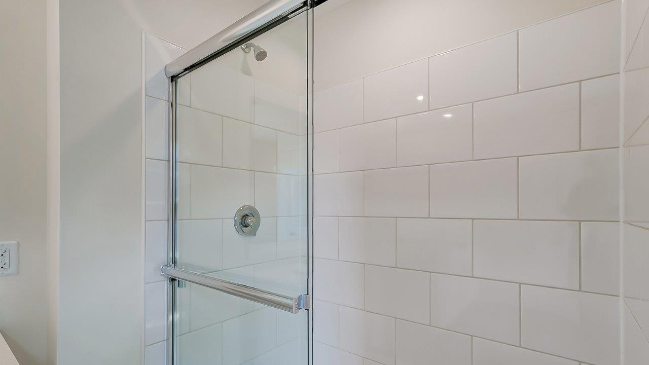 Modern bathroom featuring a walk in shower.